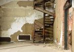 A rusting metal staircase.