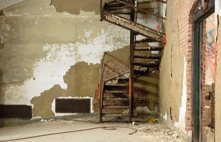 A rusting metal staircase.