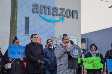State Sen. Michael Gianaris and Assemblymember Marcela Mitaynes spoke at a press conference about their bill that would require large e-commerce warehouses to reduce carbon emissions and put fewer trucks on the road.