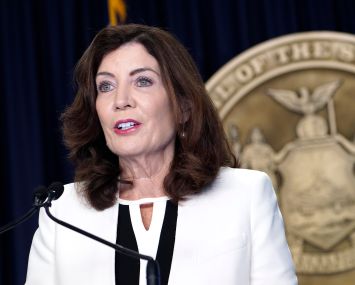 Governor Kathy Hochul in a white blazer.