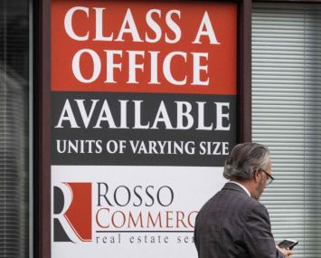 Man walks by for lease sign