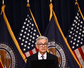 U.S. Federal Reserve Chairman Jerome Powell holds a press conference at the end of a Monetary Policy Committee meeting in Washington, D.C., on Dec. 13. The Reserve voted Wednesday to hold interest rates at a 22-year high for the third straight meeting and signaled it expects to make three cuts next year.