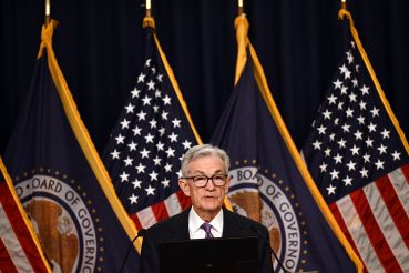 U.S. Federal Reserve Chairman Jerome Powell holds a press conference at the end of a Monetary Policy Committee meeting in Washington, D.C., on Dec. 13. The Reserve voted Wednesday to hold interest rates at a 22-year high for the third straight meeting and signaled it expects to make three cuts next year. 