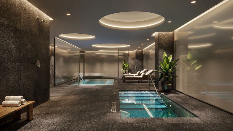 Downstairs is a plunge pool and spa, which are part of a larger amenity space in the basement.