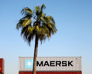 A Maersk shipping container sits on a rail car at the Port of Los Angeles in San Pedro, California. The company hauls 17 percent of the planet’s shipping containers aboard its vessels.