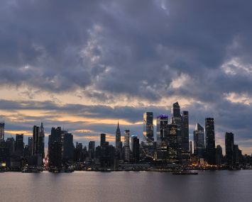 WEEHAWKEN, NJ - DECEMBER 30: The sun rises behind midtown Manhattan in New York City on December 30, 2023, as seen from Weehawken, New Jersey. (Photo by Gary Hershorn/Getty Images)