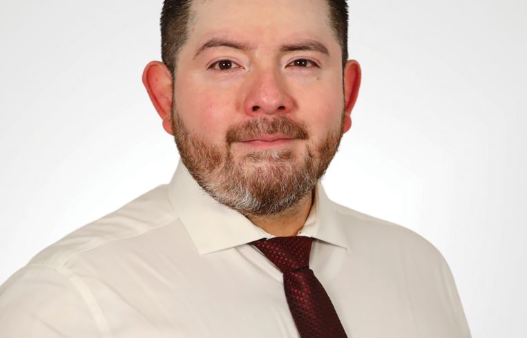 A person in a white shirt and tie.