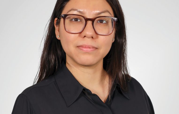 A person in a black button-down shirt.