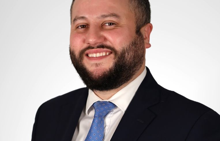 A person in a suit.
