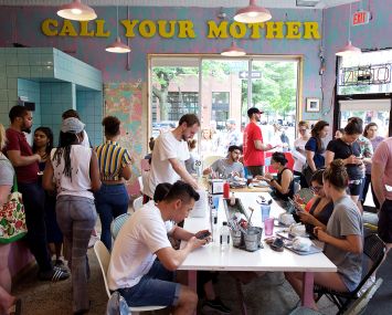Diners inside Call Your Mother Deli.
