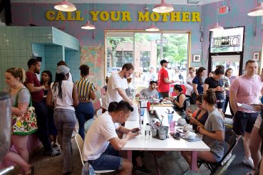Diners inside Call Your Mother Deli.