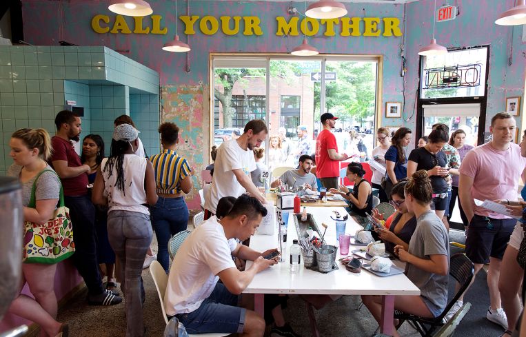 Diners inside Call Your Mother Deli.