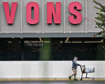 A shopper visits Vons in Los Angeles. Kroger, the parent company of Ralphs, plans to buy Albertsons, parent company of Vons, in a deal valued at $24.6 billion, a merger that would combine the two largest grocery-store chains in the U.S.