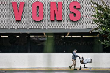 A shopper visits Vons in Los Angeles. Kroger, the parent company of Ralphs, plans to buy Albertsons, parent company of Vons, in a deal valued at $24.6 billion, a merger that would combine the two largest grocery-store chains in the U.S.