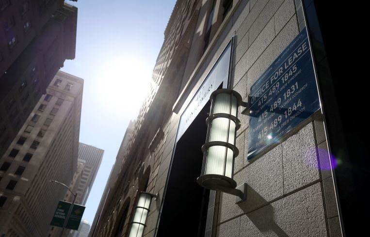 A sign advertising commercial space for lease on an office building in San Francisco, California.
