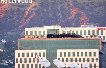 Netflix offices and Sunset Bronson Studios (both owned by HPP) are seen in front of the Hollywood in Los Angeles.