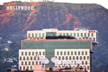 Netflix offices and Sunset Bronson Studios (both owned by HPP) are seen in front of the Hollywood in Los Angeles.