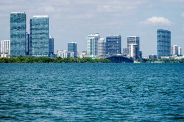 Miami Beach, Florida, Biscayne Bay water, Edgewater Midtown high rise skyline with Julia Tuttle Causeway Bridge. 