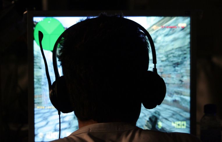 A contestant plays a computer game during an e-sports gaming tournament.