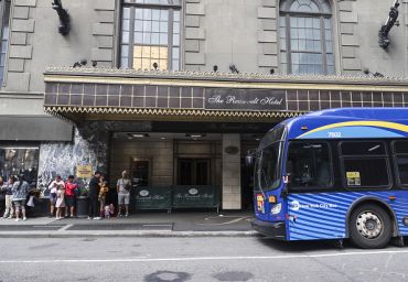 Asylum seekers line up in front of the Roosevelt Hotel, converted into a city-run shelter for newly arrived migrant families in New York City, in late September 2023.