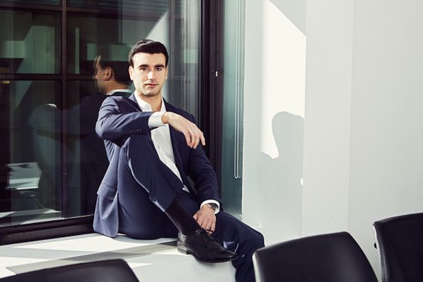 A man sitting on a windowsill.