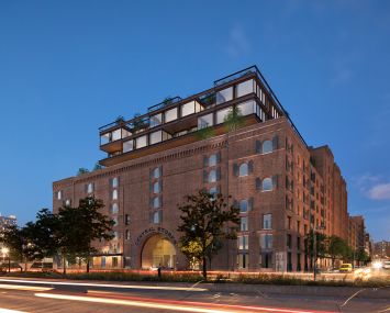 The conversion of the 1.2-million-square-foot Terminal Warehouse into office involves a new six-story addition painted in bright red and yellow.