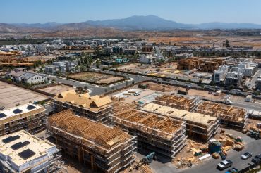 An aerial view of workers constructing new homes in The Great Park Neighborhoods in Irvine.
