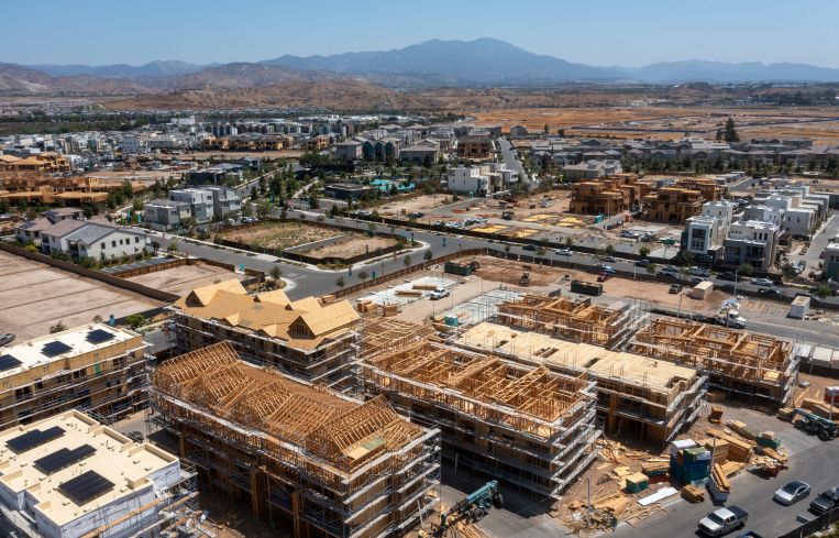 An aerial view of workers constructing new homes in The Great Park Neighborhoods in Irvine.