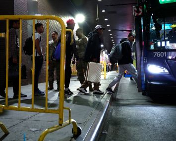 Asylum seekers are transferred via city bus from Port Authority bus terminal