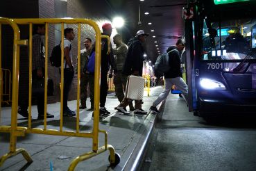 Asylum seekers are transferred via city bus from Port Authority bus terminal