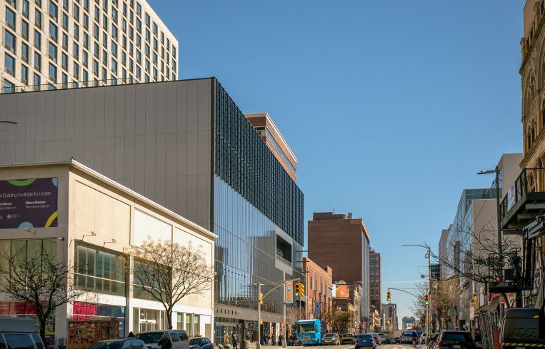 The exterior of the commercial side of the new National Urban League building at 117 West 125th Street. The ground floor is retail, and the next five floors are office.