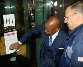 Mayor Eric Adams posts a notice on the Hotel Hayden