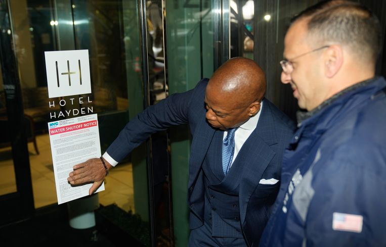 Mayor Eric Adams posts a notice on the Hotel Hayden