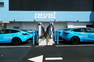 A charging station for the newly launched app-based car service Revel stands in a Brooklyn neighborhood on August 02, 2021 in New York City.