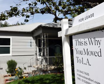 A "For Lease" sign is posted in front of a house available for rent in Los Angeles, California.