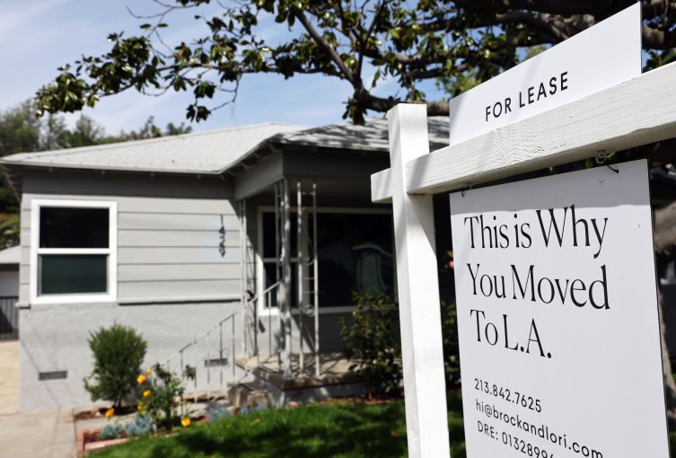 A "For Lease" sign is posted in front of a house available for rent in Los Angeles, California.