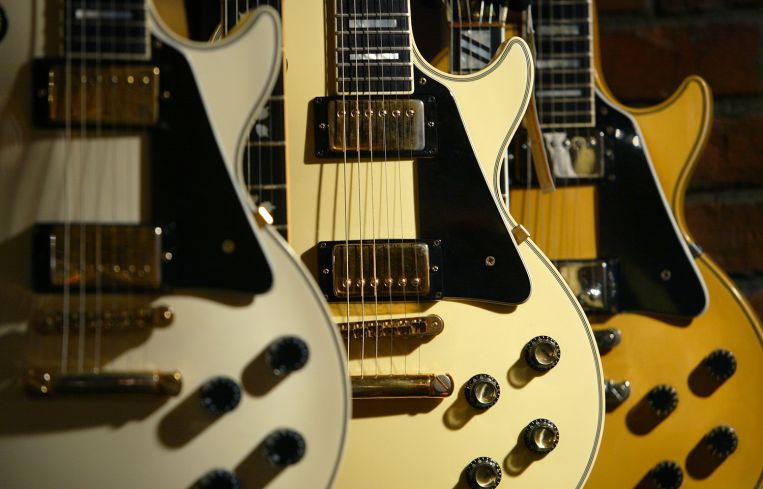 Les Paul Custom guitars at a Guitar Center store.