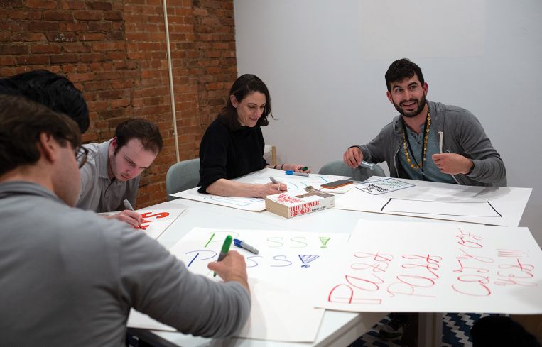 Open New York members (from left to right) Salvatore Palma, David Gordon, Rachel Kaplan and Barak Gila make signs for a pro-housing rally, April 4, 2024.