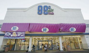 A shopper leaves one of the 99 Cents Only Stores in 2004 in California.