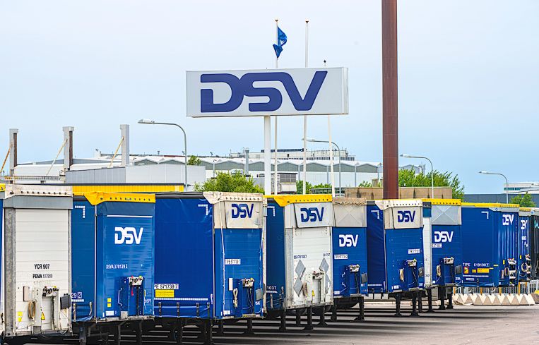 Row of DSV freight trailers at a parking lot.
