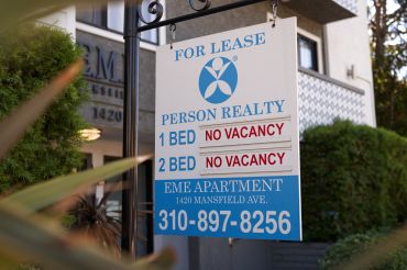 A 'no vacancy' sign for rentals is displayed outside an apartment building in Los Angeles, California.