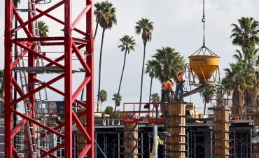 Construction workers build a mixed-use apartment complex in Los Angeles. Approved California permits for the first three months accounted for just 8,972 new units, the slowest quarter for new plans in the Golden State since 2014.