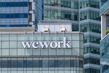 A WeWork logo on a building