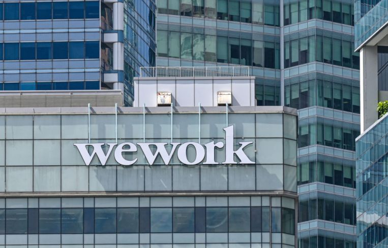 A WeWork logo on a building
