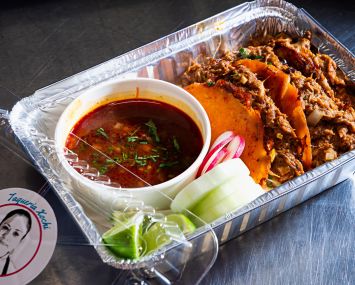 Lamb quesabirria with dipping sauce at Taqueria Xochi