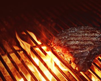 Steak on a grill.