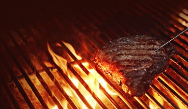 Steak on a grill.