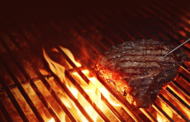 Steak on a grill.