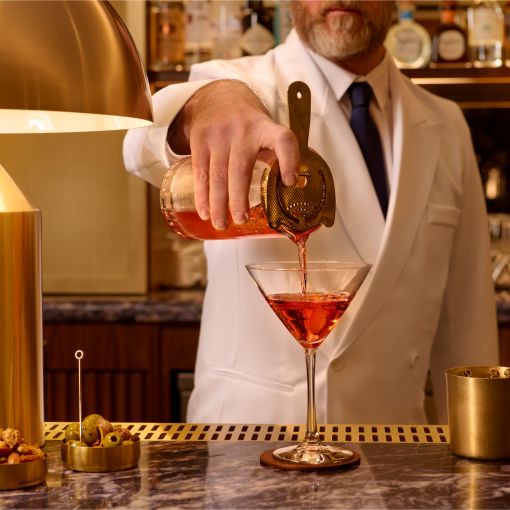 Bartender serving drinks at the Paramount Club.