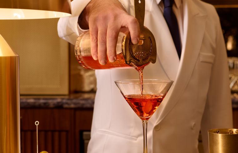 Bartender serving drinks at the Paramount Club.